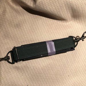 dark green and blue strap man made material